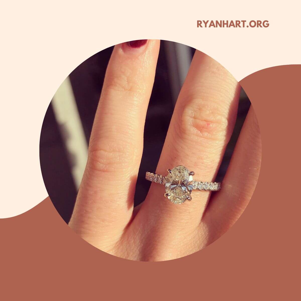 Woman wearing oval diamond ring