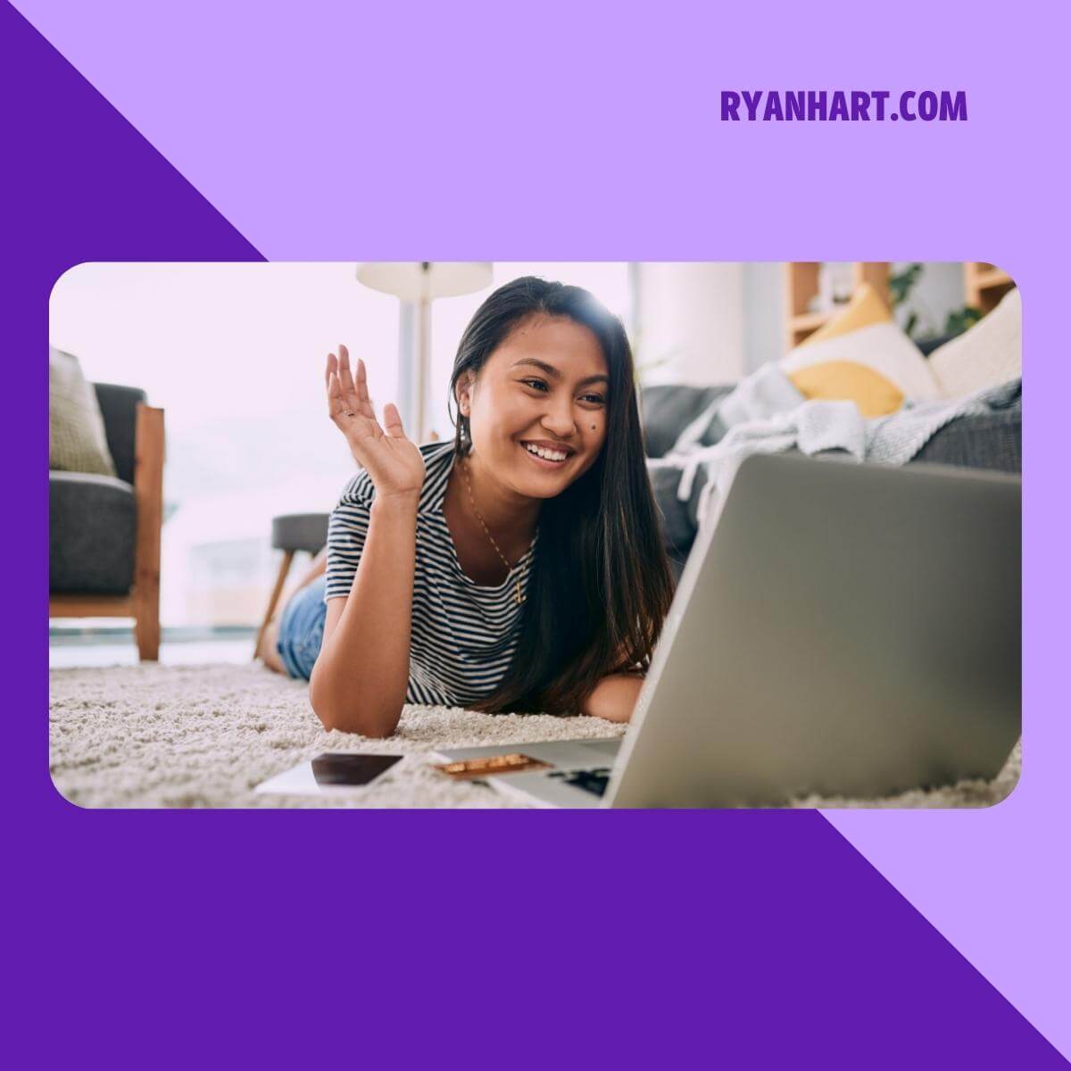 Woman sitting on bed looking at computer