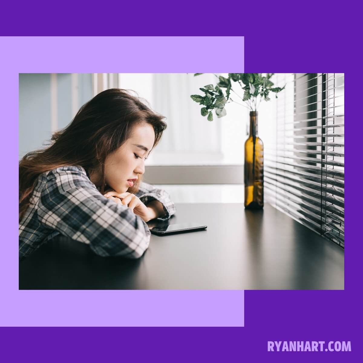 Woman looking down at phone