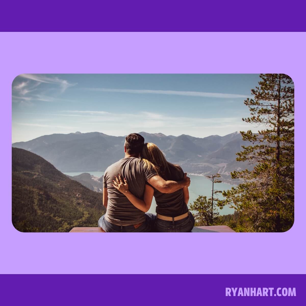 Couple looking at lake and mountains in distance