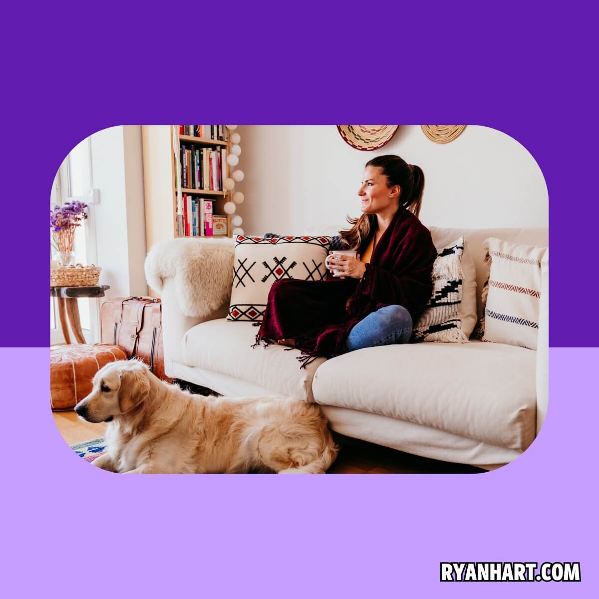 Woman sitting on couch with dog