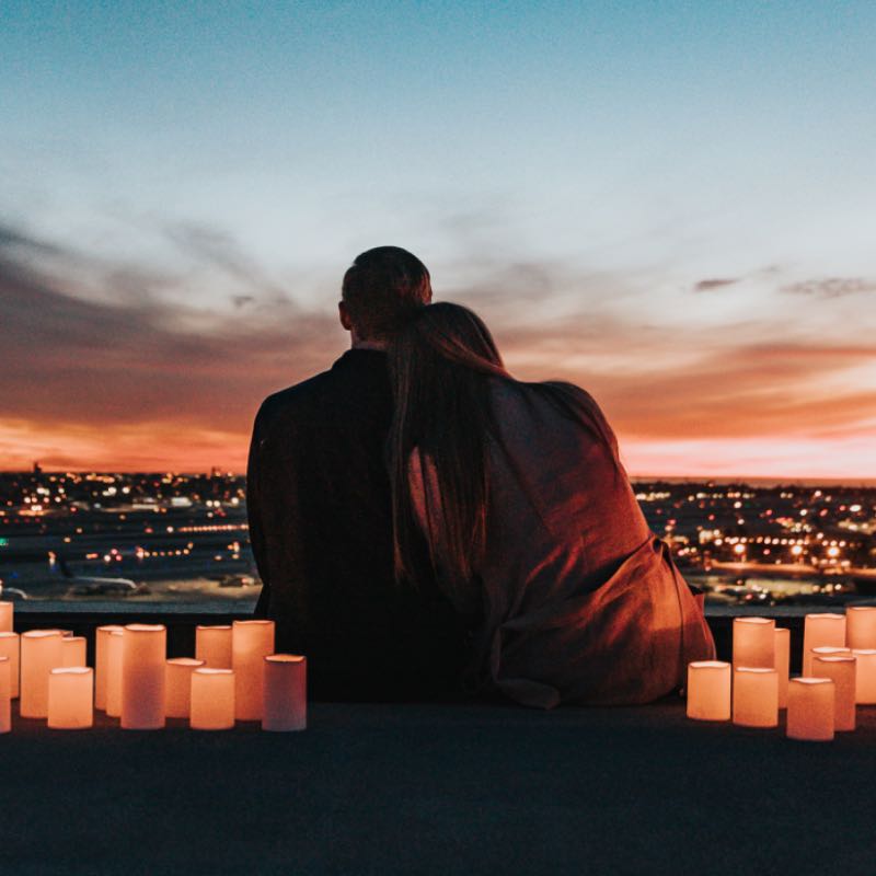Couple surrounded by candles