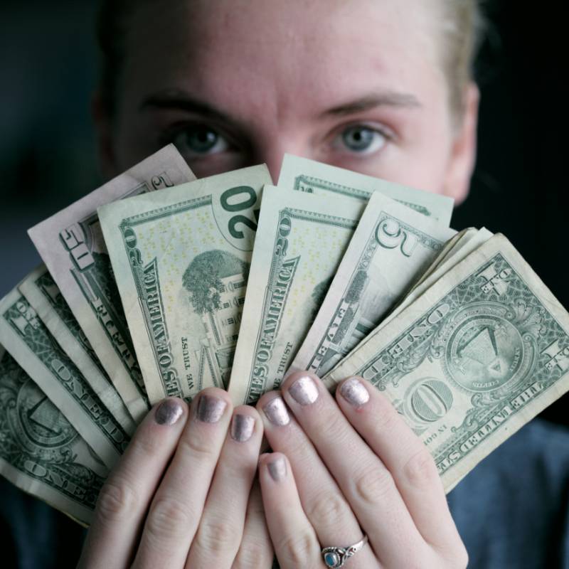 Woman Holding Money