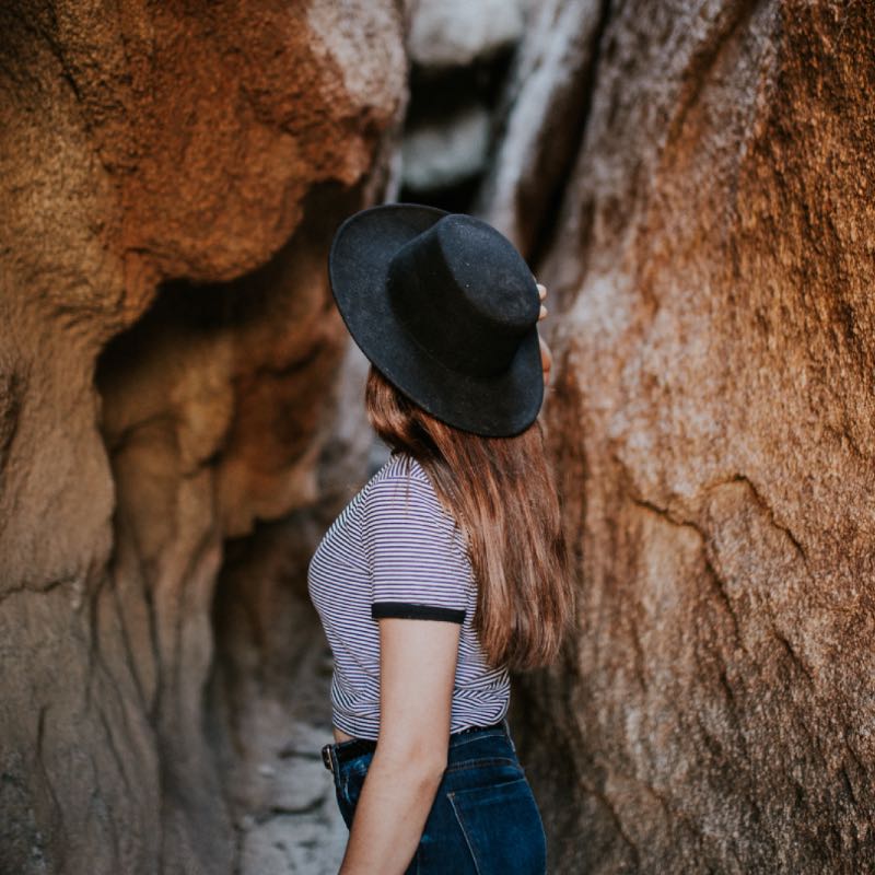 Woman Entering a Cave