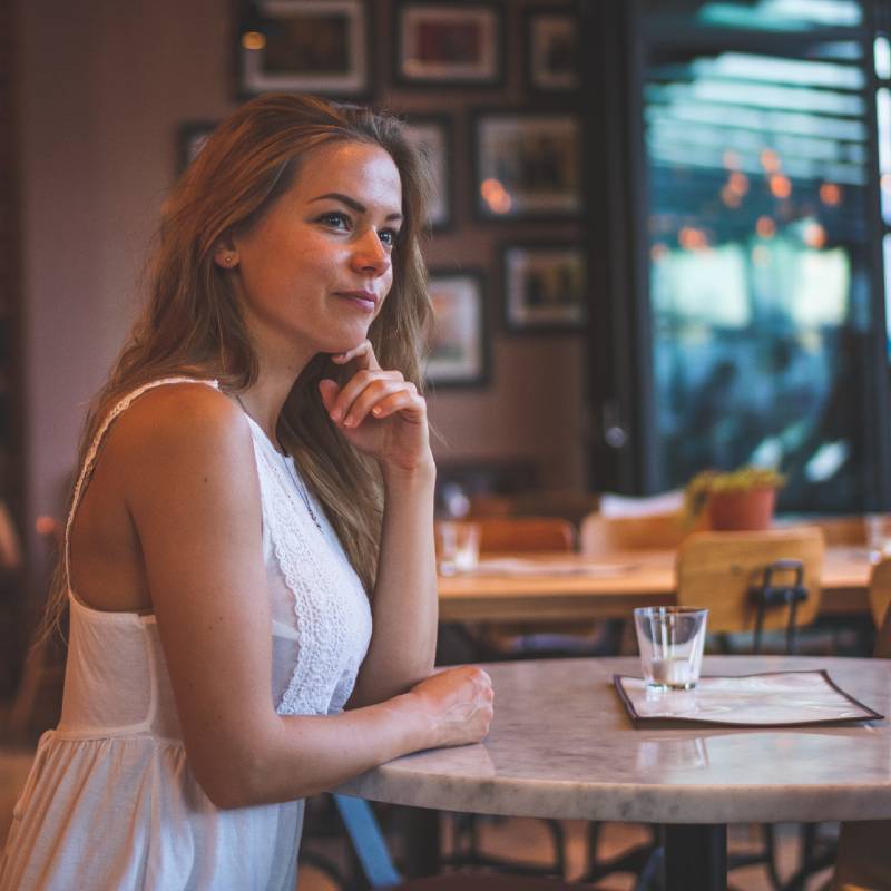 Woman Sitting at Coffee Shop