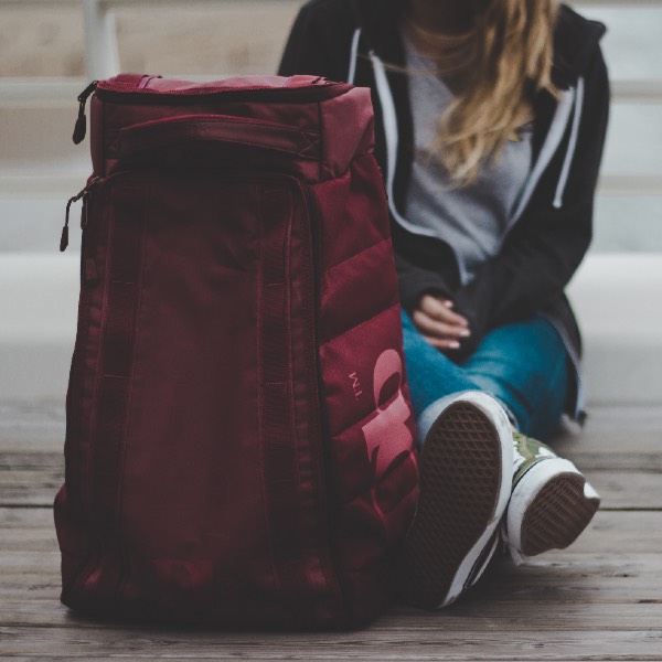 Woman sitting with luggage