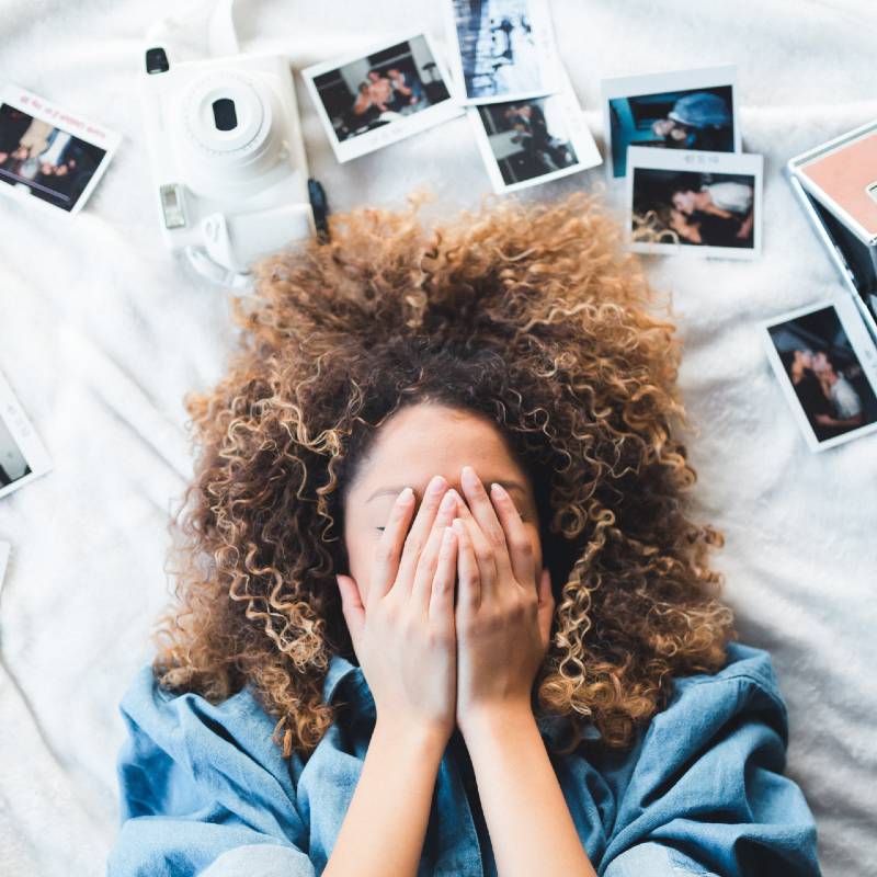 Woman with Polaroid Photos