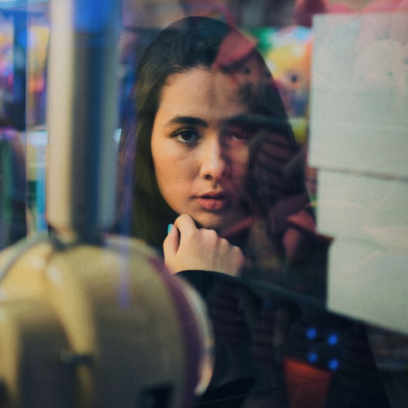 Woman Looking Through Window