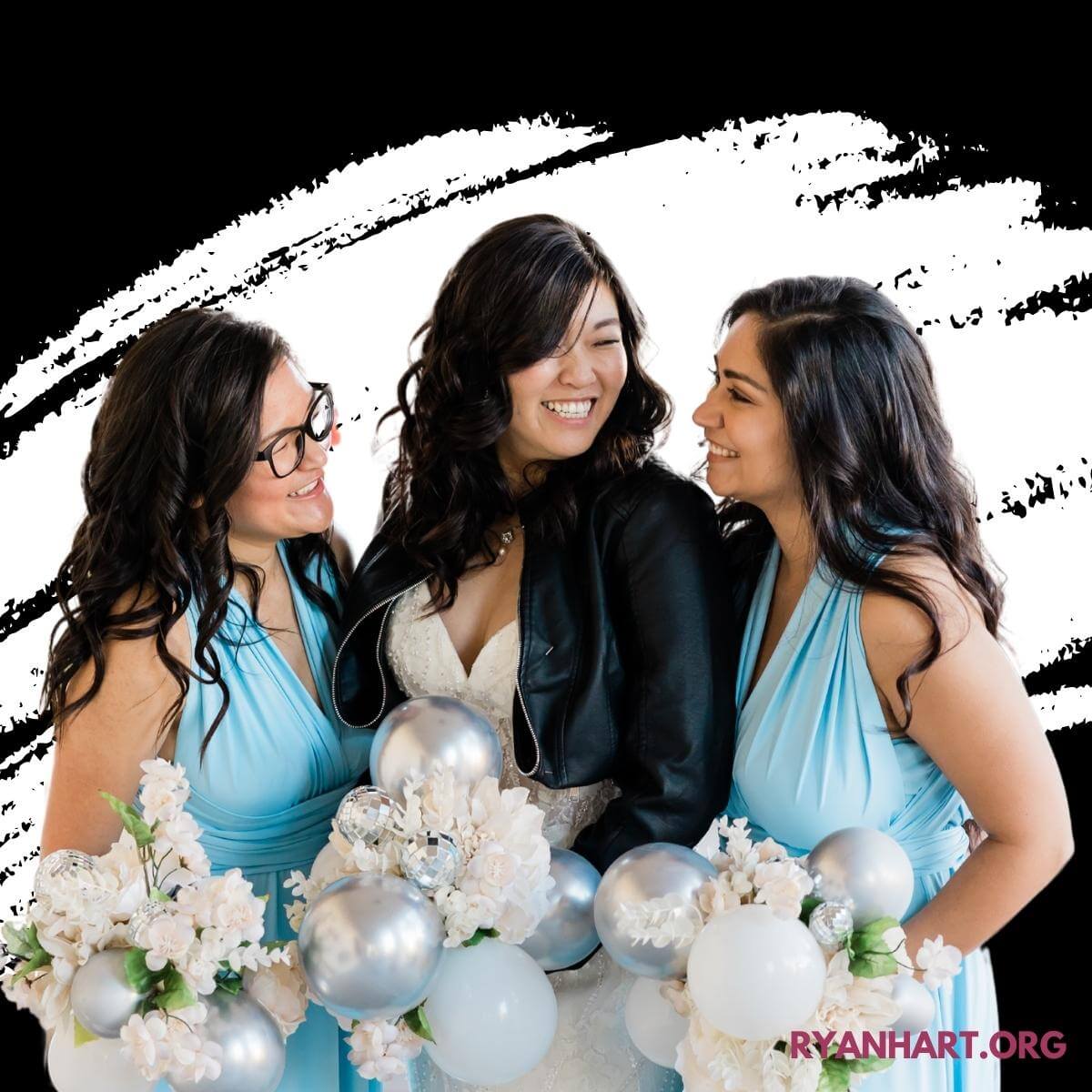 Bride and two bridesmaids smiling